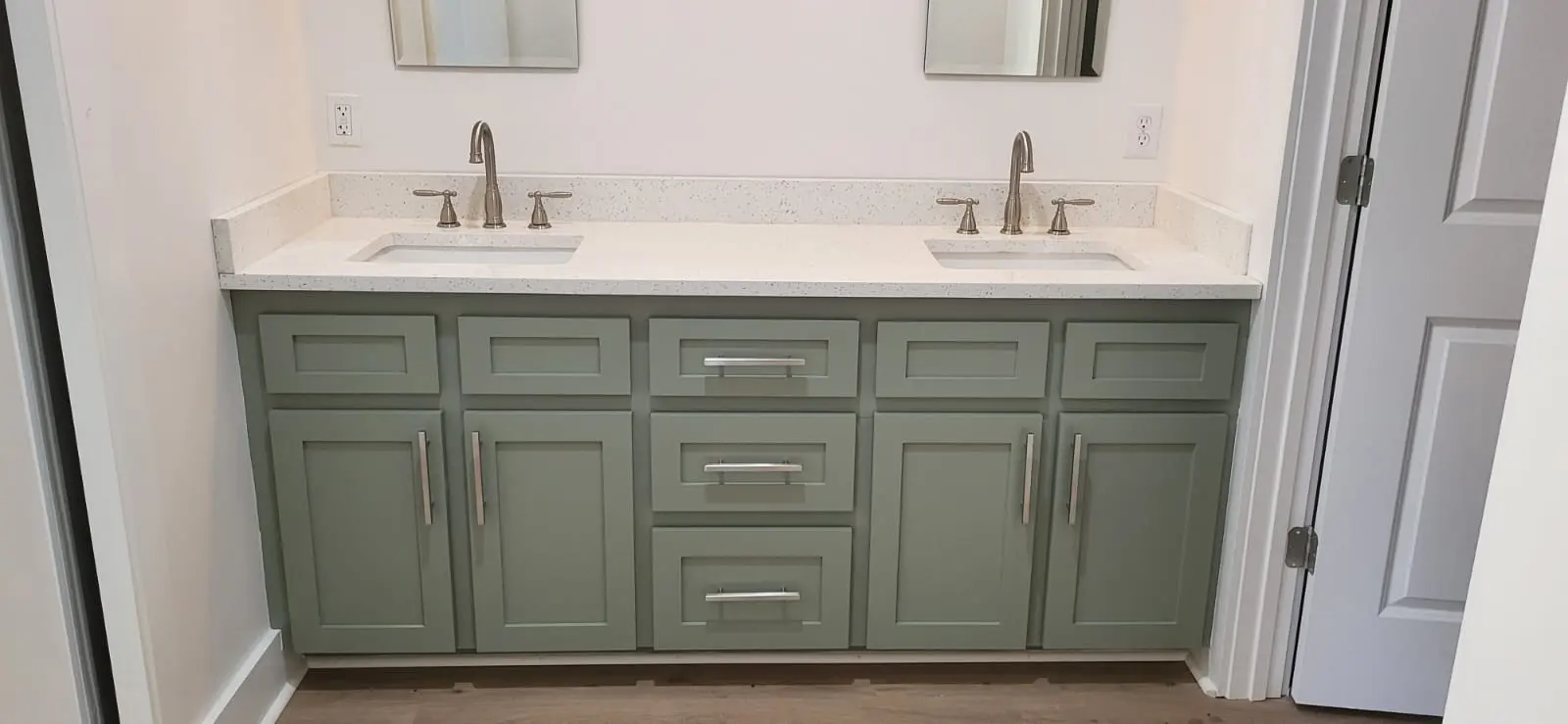Custom sage green bathroom vanity cabinets in Hattiesburg, MS