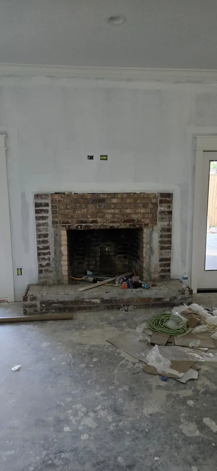Renovation work in progress on a fireplace surround in Hattiesburg, MS